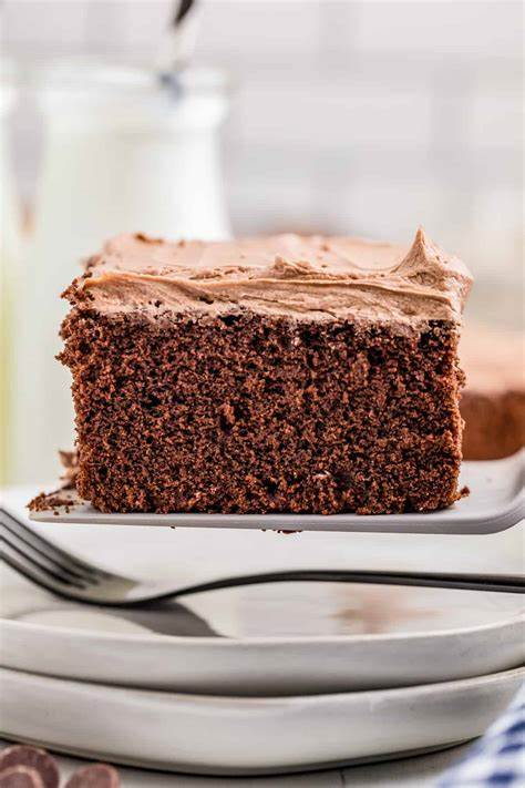 Square slice of cake with a fork next to it